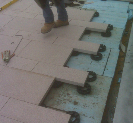 Stackable supports on an inverted waterproofing system Stackable supports on an inverted waterproofing system