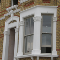 Cast stone architectural features to match adjacent properties