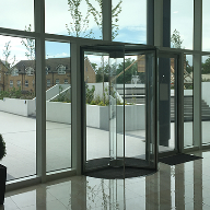 Minimalist full-glass revolving door for ISLAND tower