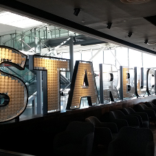 Striking feature sign for Starbucks at Heathrow