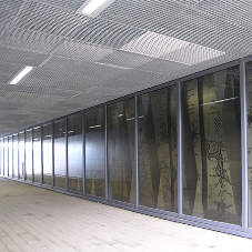 Steel grating used as ceiling panels for station