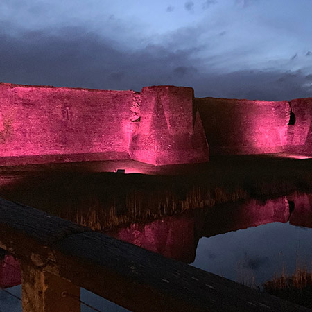 Powerful floodlights illuminate Caerphilly Castle