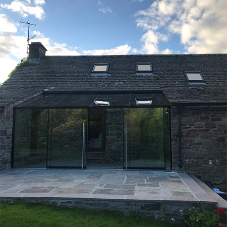 New glass extension for picturesque cottage in Wales