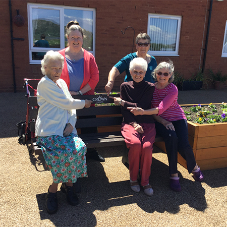 Crown Paints donates bench to sheltered housing scheme