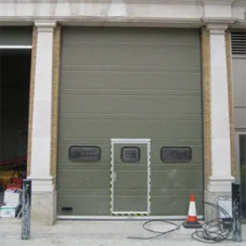 Oak-clad overhead sectional doors for the renovation of the old Territorial Army stores