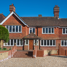 Traditional home refreshed with white replacement steel windows