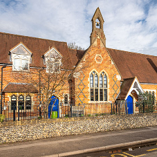 A combination of intricately shaped head windows manufactured by Clement for historic school