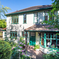 Bespoke green steel windows and doors for Art Deco style London home