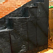 TWS EX-100 self adhesive membrane applied to primed blockwork