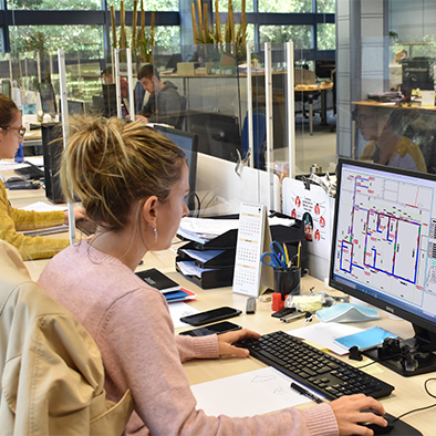 ULMA's engineers studying a client's project