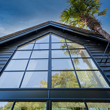 Steel door screens by Clement Windows feature at Grade II listed private residence in West Sussex