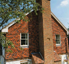 Tudor Roof Tile adds style and value with vertical hanging tiles