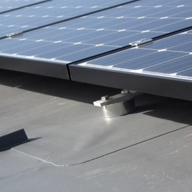 Engineered solutions for fixing solar panels to flat roofs