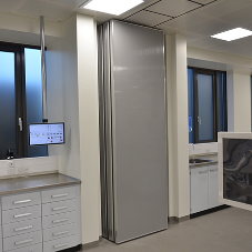 Acoustic movable walls for pharmaceutical company