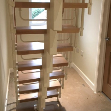 Compact loft conversion stairs for family home