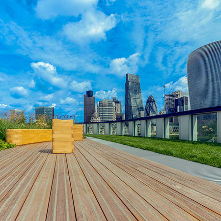 Wooden decking area of roof terrace ensures relaxation for workers