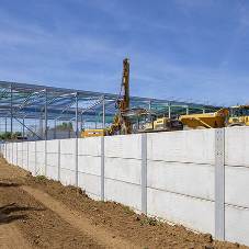 FP McCann’s prestressed horizontal walling panels utilised on king post retaining wall