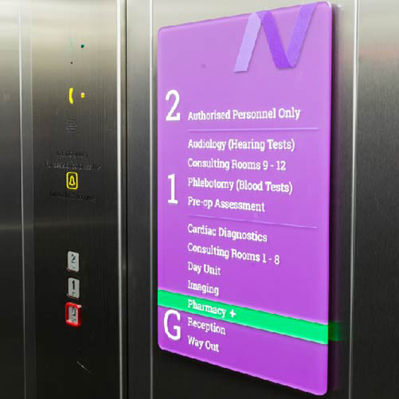 Vibrant purple internal signage for New Victoria Hospital