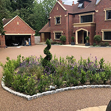 Riverbed gravel is the perfect highlight to this driveway renovation