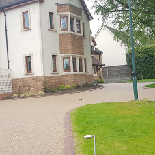 Driveway surfacing compliments exposed brickwork at Essex home