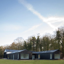 Charred cladding add contemporary twist to barn style home