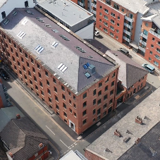 Natural and mechanical smoke ventilation within a Grade II listed former Printing Mill