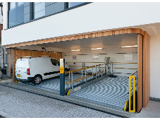 Side sliding garage door benefits stack up for parking lifts