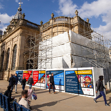 Protective site hoarding for architectural masterpiece with Holy Well Glass