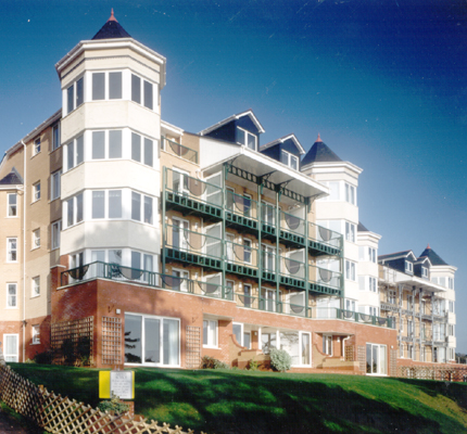 White cellular PVC-UE fascia board, bargeboard and soffit used at the roofline of each apartment block