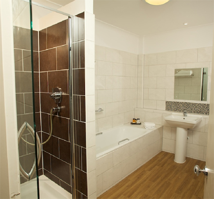 Earthy slate Dartmoor Naturals Pulpis tiles used within the Premier rooms shower enclosures