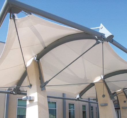 A single layer of PVC Type-2 is tensioned by Galfan coated cables at the canopy perimeter