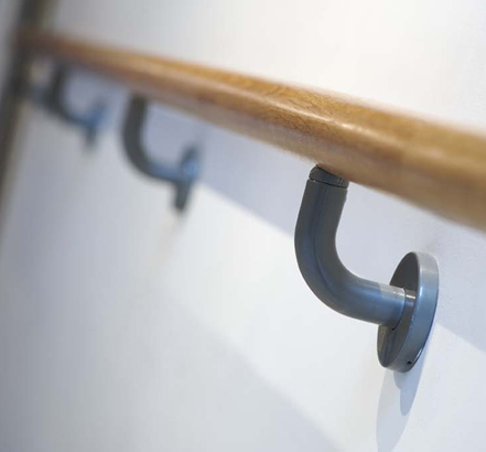 Seamless White oak handrails, secured with Duracoat wall brackets