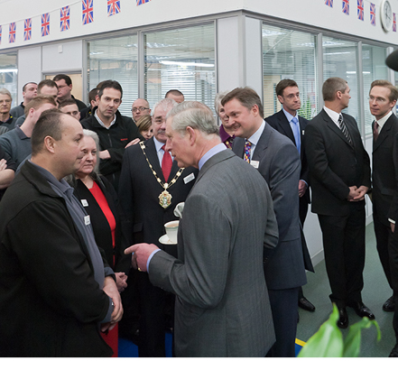 The Prince of Wales is shown around the factory