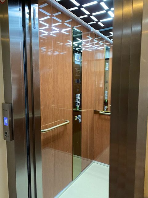 The new Stannah lift features reflective surfaces to add the perception of depth to the floor space of the lift, as well as touches that reflect the glitz and glamour of the Arts and Crafts Movement, such as brass panels and handles.